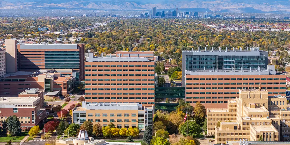 University of Colorado Anschutz campus, with Denver and the Rocky Mountains in the background.