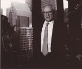 David N. Judelson beside a window overlooking New York, in Ozier Muhammad's historical photograph from the 2001 New York Times reprint shared by BHOC.