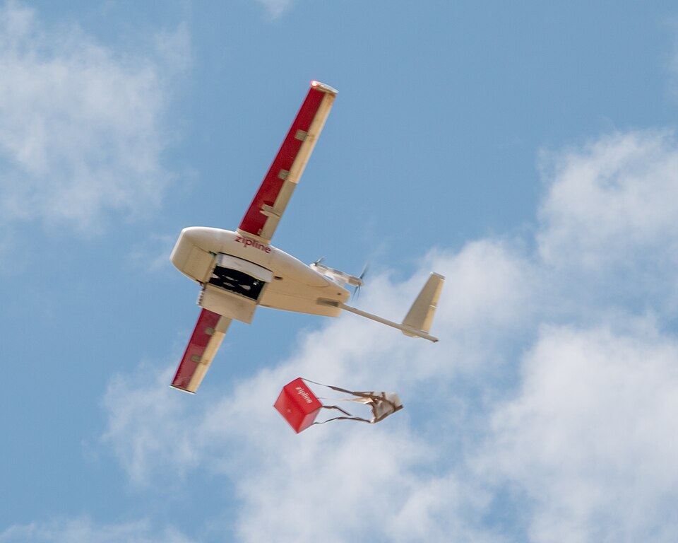 Zipline medical delivery drone dropping a package in Rwanda